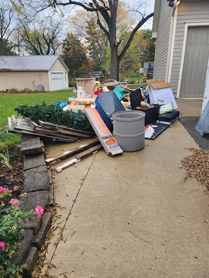 Dumpster being loaded with debris for 3 Yard Dumpster Rental in Walworth
